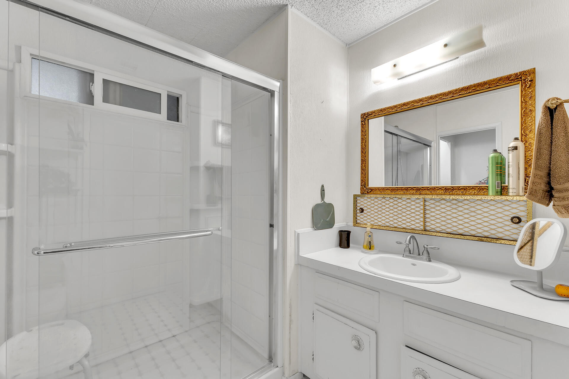 219 Stone Terrace Palm Springs, CA 92264 - Photo 36 of 41 a bathroom with a sink and a mirror