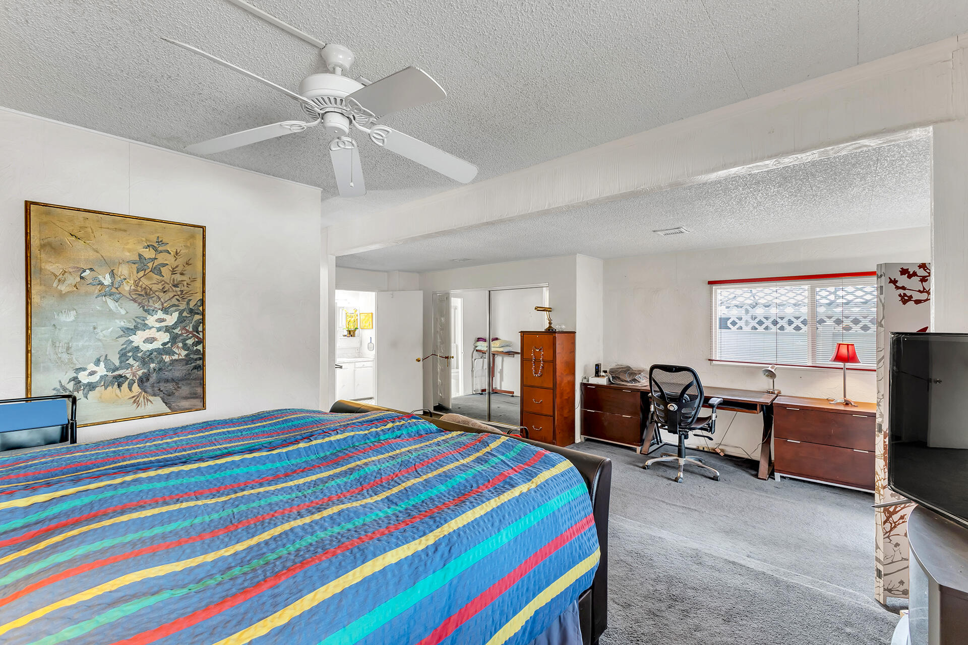 219 Stone Terrace Palm Springs, CA 92264 - Photo 39 of 41 a bedroom with a bed and furniture