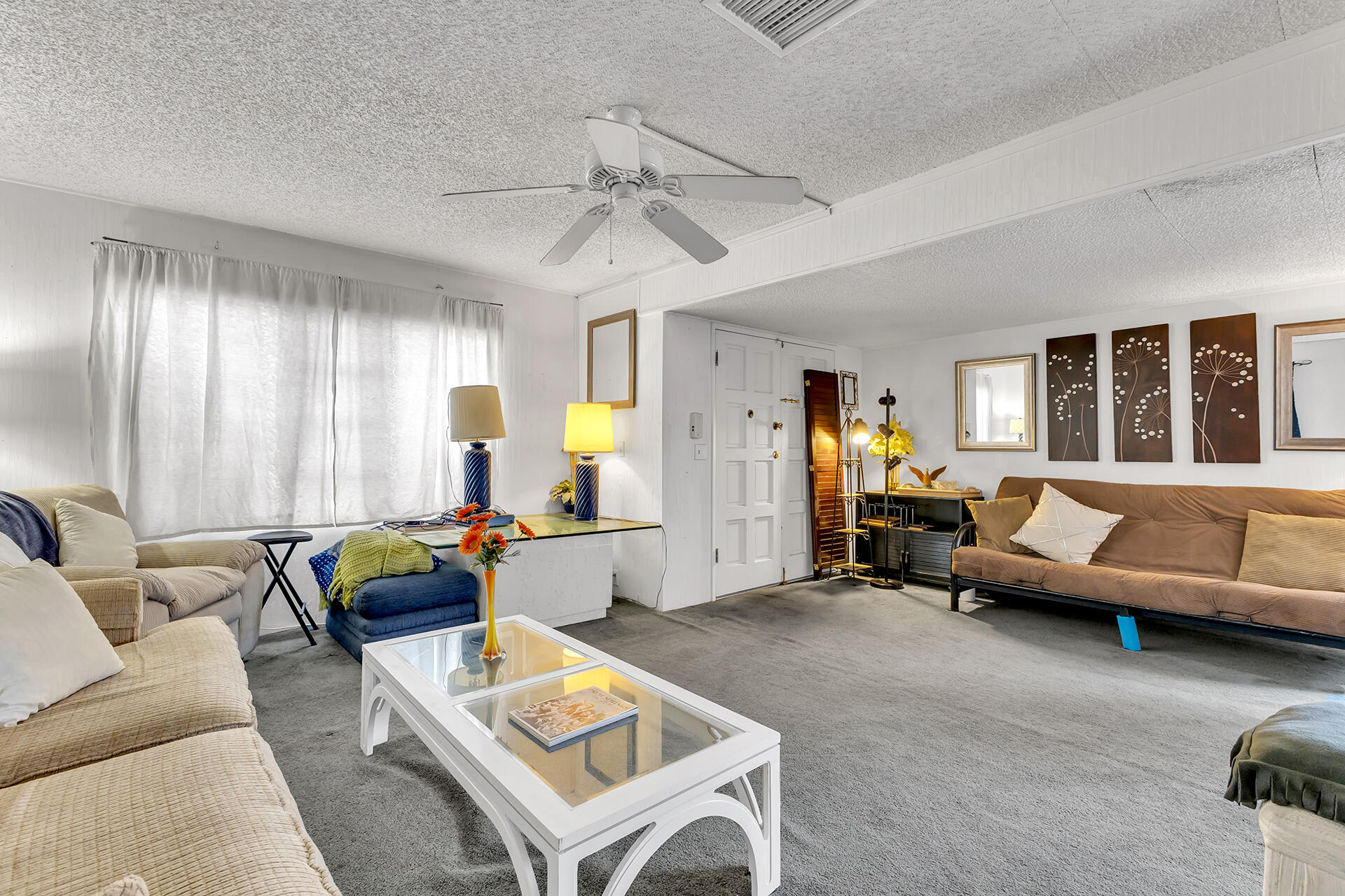219 Stone Terrace Palm Springs, CA 92264 - Photo 5 of 41 a living room with furniture and a large window
