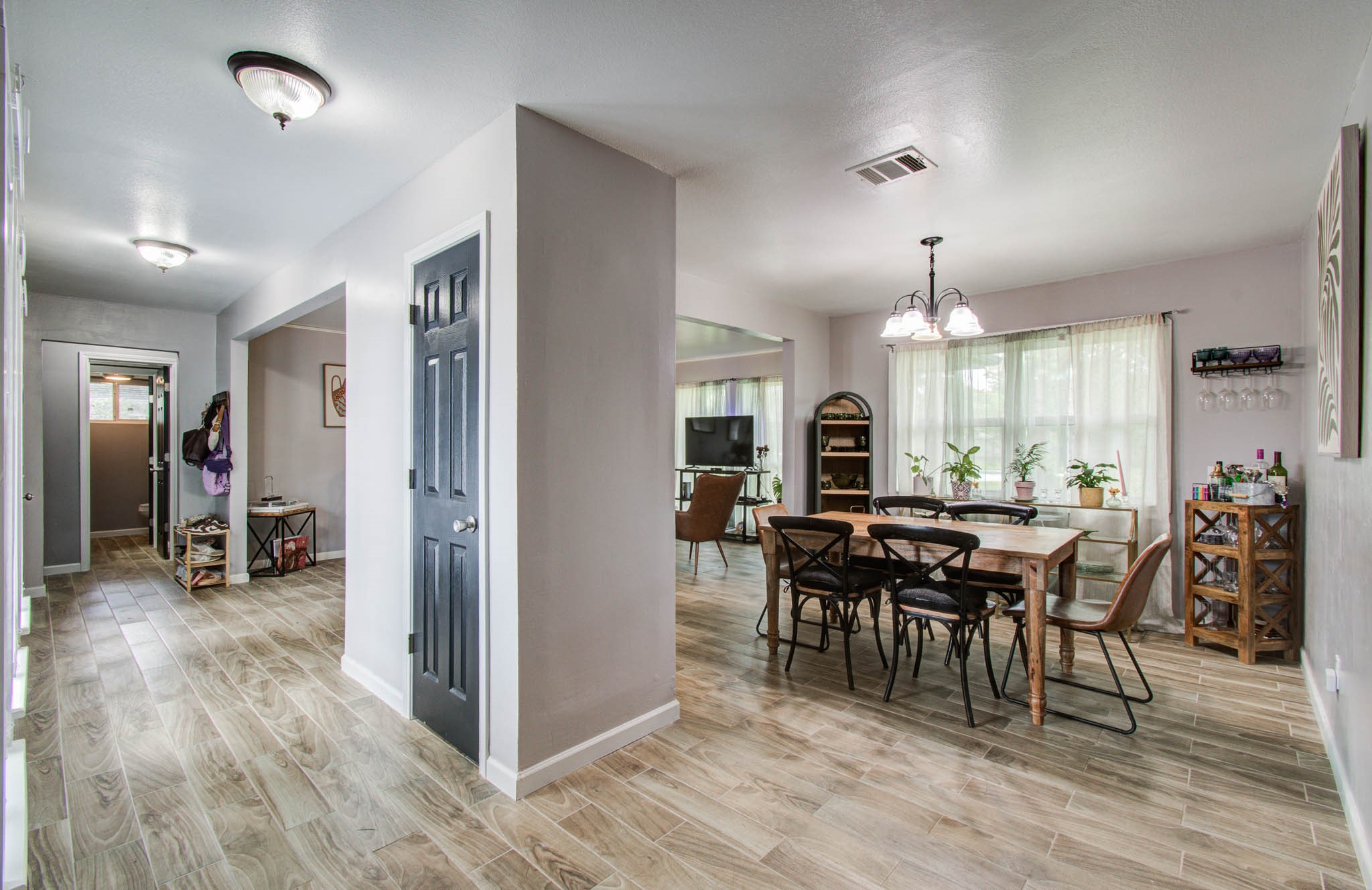 1327 Fallbrook Drive Houston, TX 77038 - Photo 18 of 34 a view of a a dining room with furniture window and wooden floor