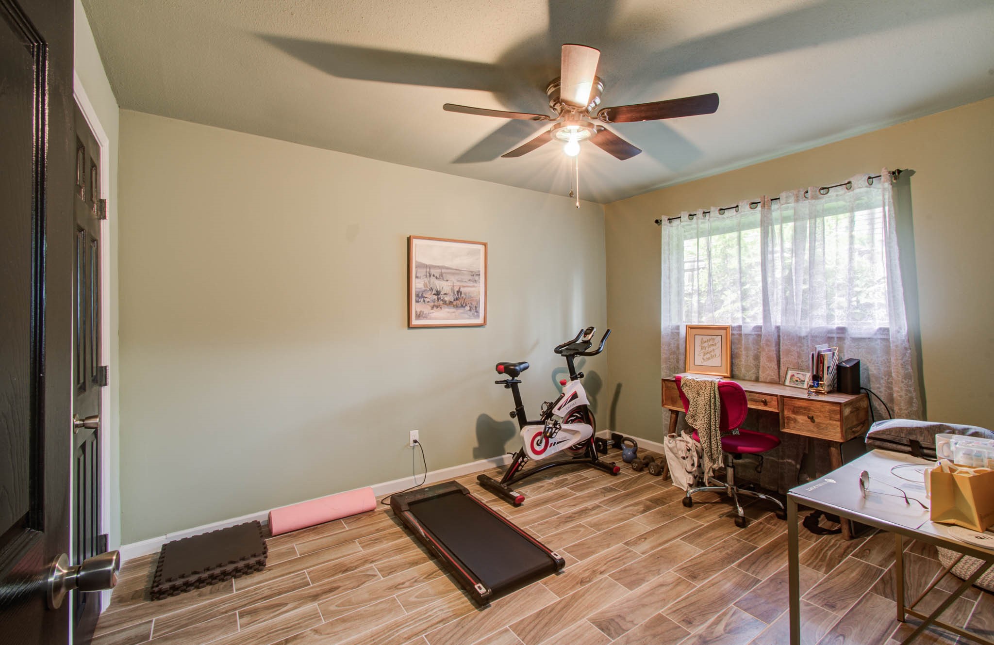 1327 Fallbrook Drive Houston, TX 77038 - Photo 27 of 34 a room with gym equipment and view of living room