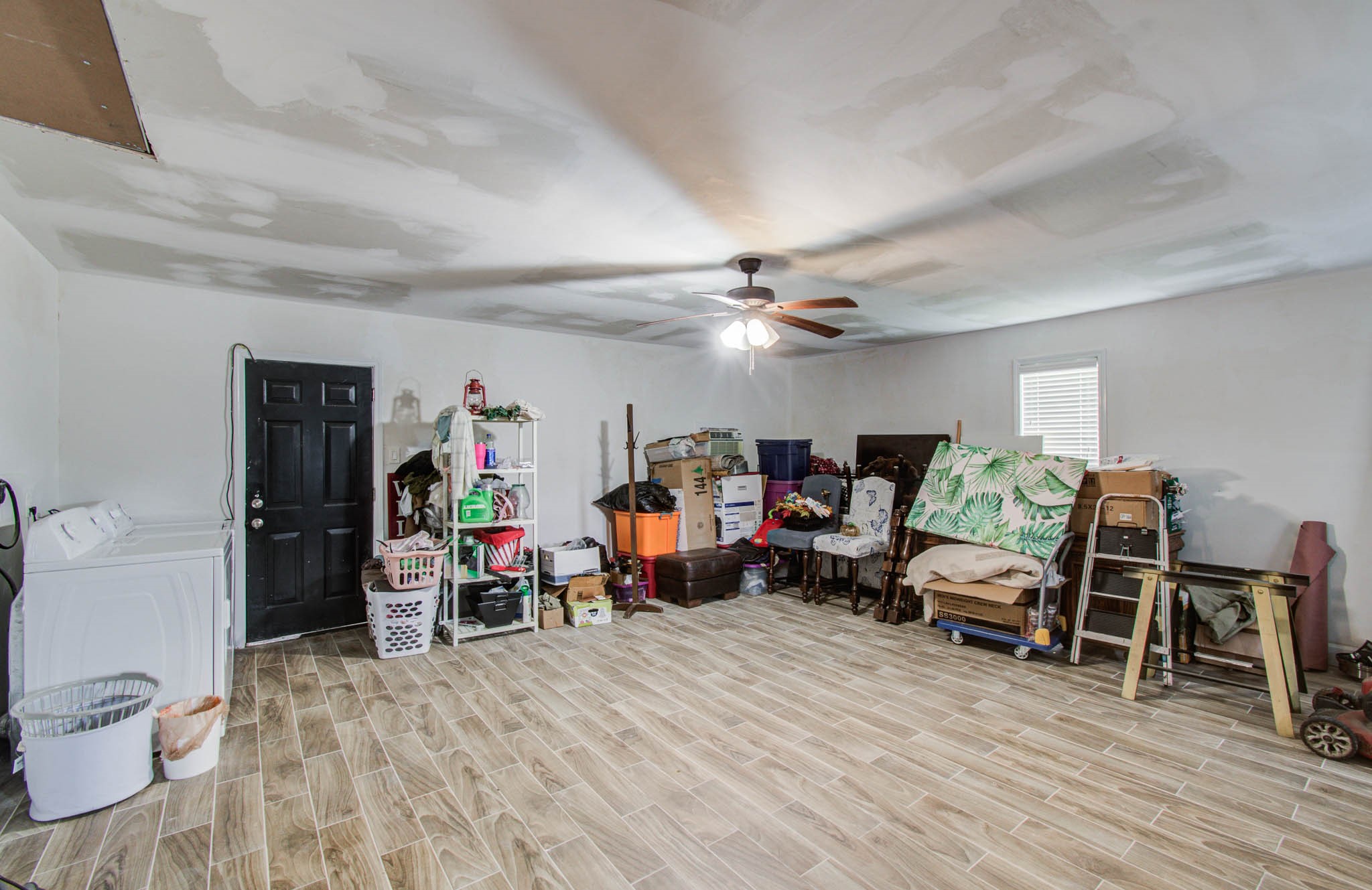 1327 Fallbrook Drive Houston, TX 77038 - Photo 28 of 34 a living room with furniture and a wooden floor