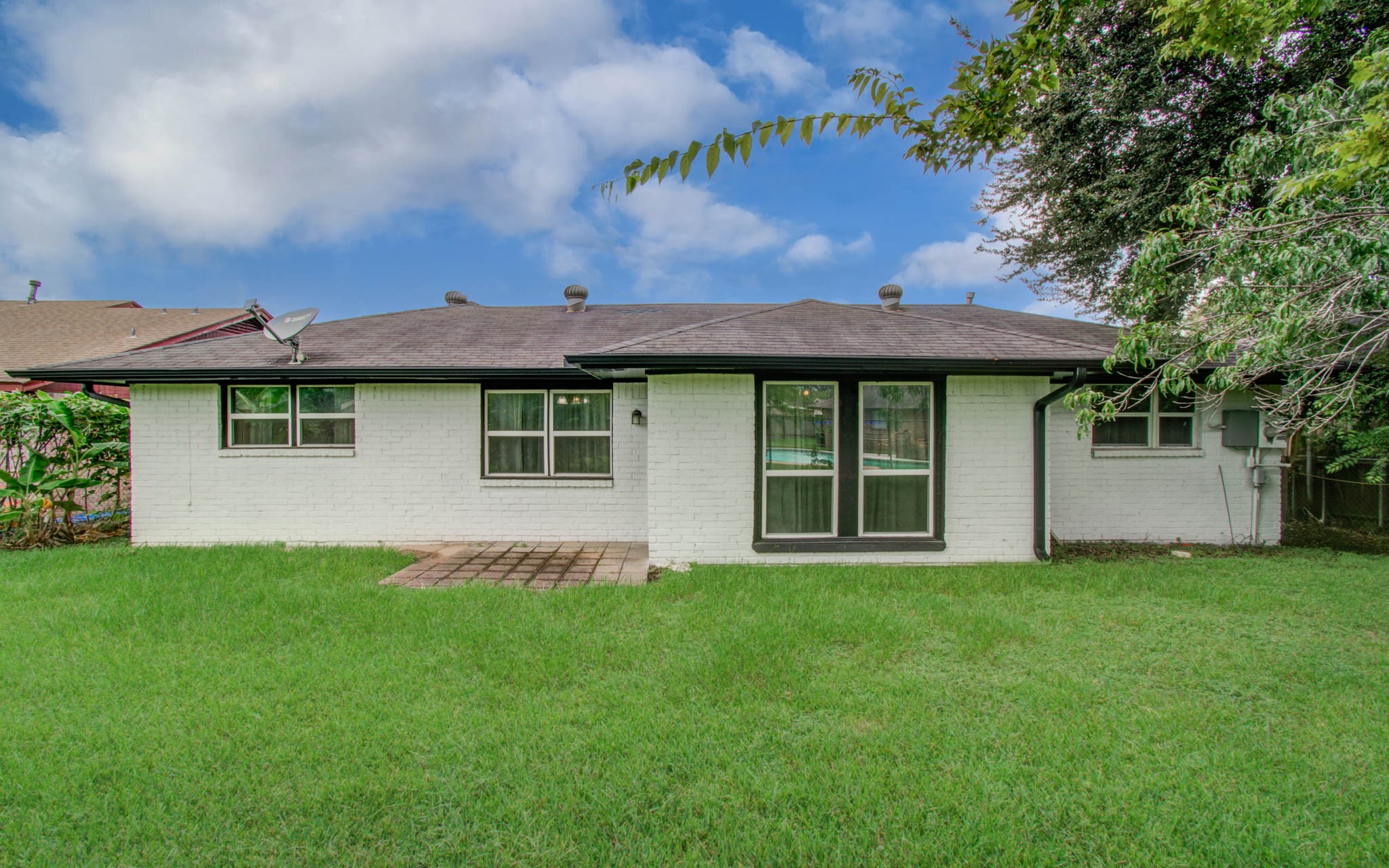1327 Fallbrook Drive Houston, TX 77038 - Photo 33 of 34 a view of a house with a garden