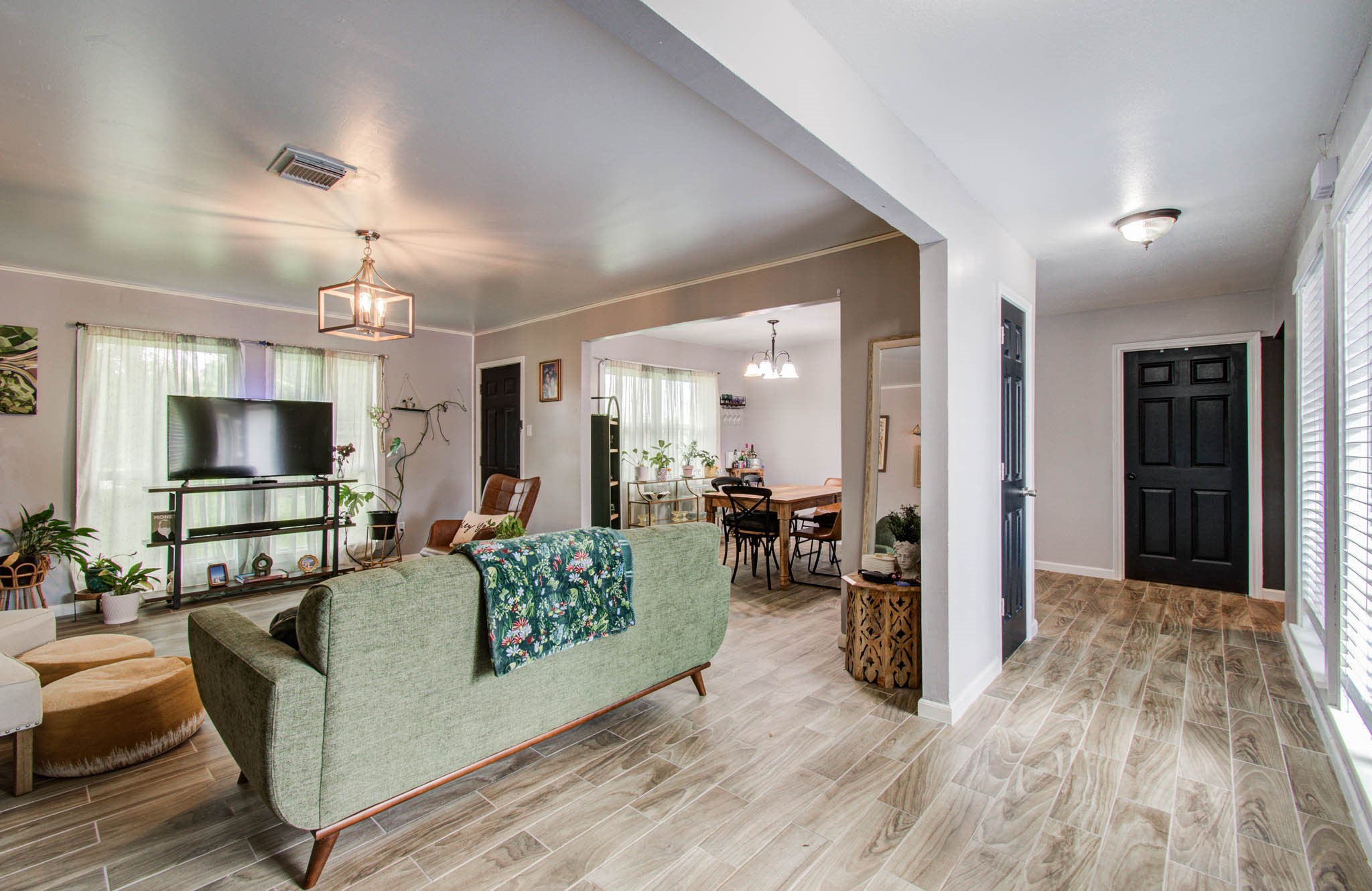 1327 Fallbrook Drive Houston, TX 77038 - Photo 8 of 34 a living room with furniture and a flat screen tv