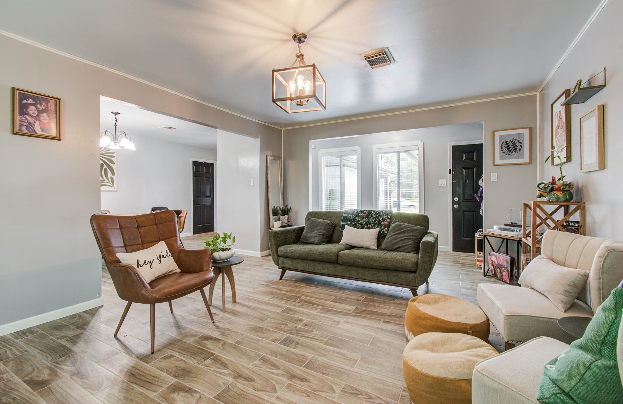 1327 Fallbrook Drive Houston, TX 77038 - Photo 10 of 34 a living room with furniture and a chandelier
