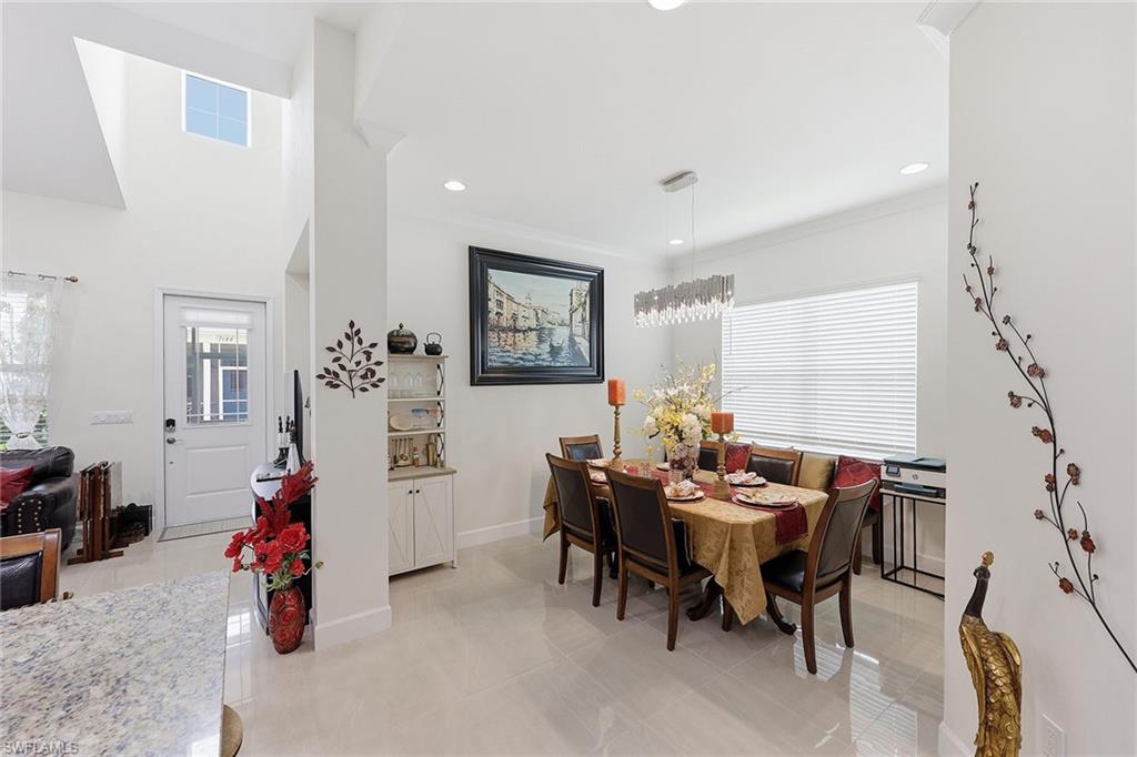 7204 Cayo Coco Lane Naples, FL 34113 - Photo 11 of 22 a living room with furniture and wooden floor