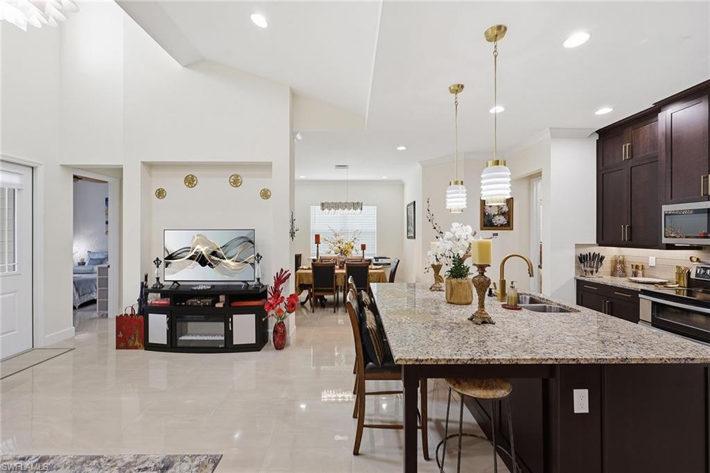 7204 Cayo Coco Lane Naples, FL 34113 - Photo 12 of 22 a view of a dining room and livingroom