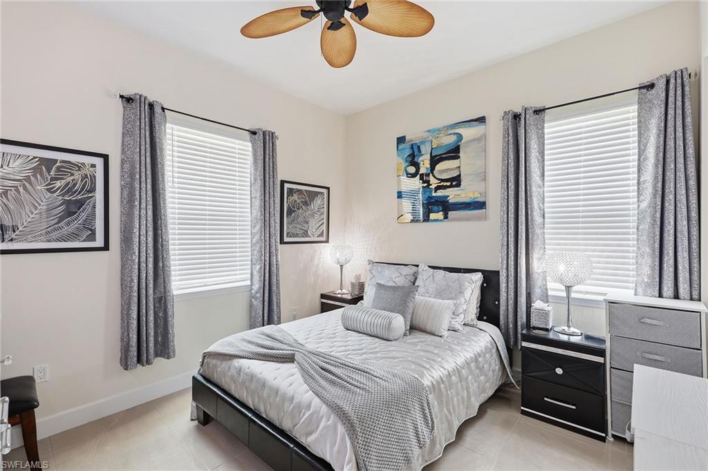 7204 Cayo Coco Lane Naples, FL 34113 - Photo 18 of 22 a bedroom with bed and window