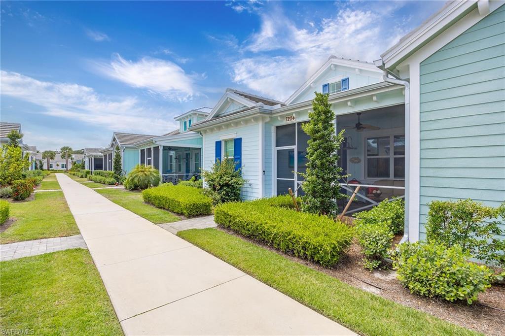 7204 Cayo Coco Lane Naples, FL 34113 - Photo 2 of 22 a view of a house with backyard and garden