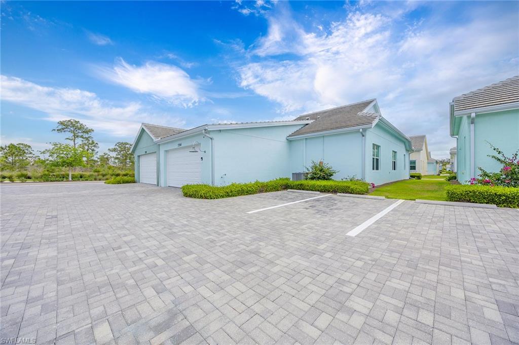 7204 Cayo Coco Lane Naples, FL 34113 - Photo 22 of 22 a view of a house with a big yard and large trees