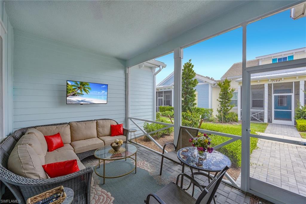 7204 Cayo Coco Lane Naples, FL 34113 - Photo 4 of 22 a living room with furniture and a large window