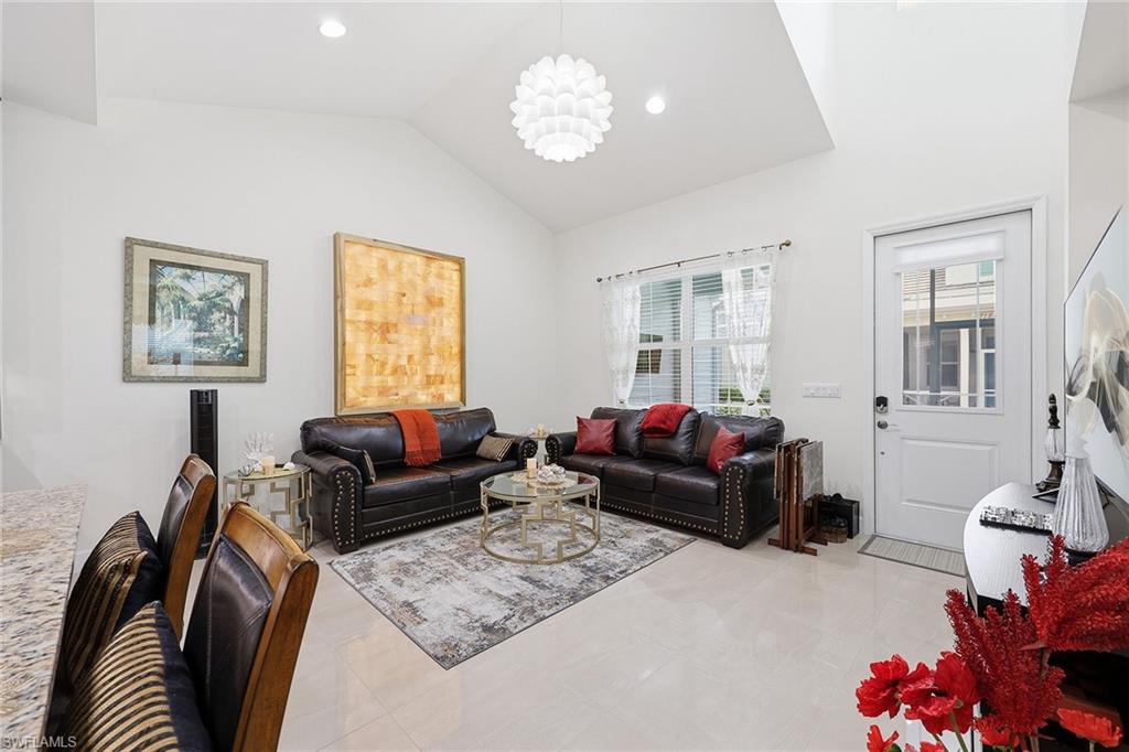 7204 Cayo Coco Lane Naples, FL 34113 - Photo 8 of 22 a living room with furniture and a window