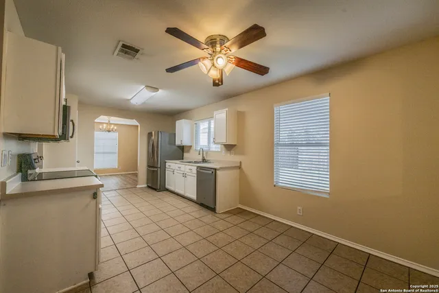a kitchen with a cabinets and window