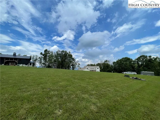 a view of a house with a big yard