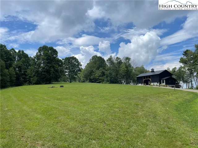 a view of a patio with table and chairs and potted plants