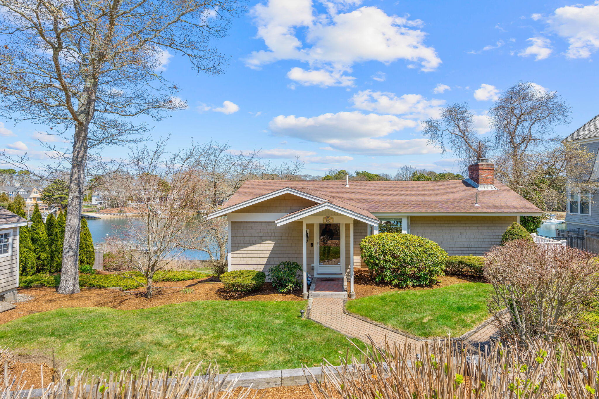 160 Waterway Mashpee, MA 02649 - Photo 2 of 41 a front view of a house with garden