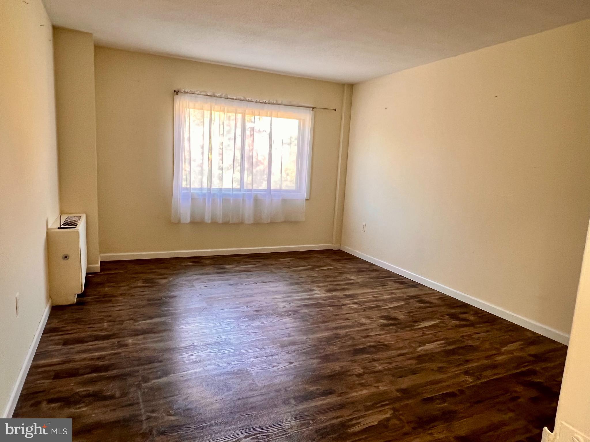 100 West Avenue, Unit 418S Jenkintown, PA 19046 - Photo 11 of 18 wooden floor in an empty room with a window