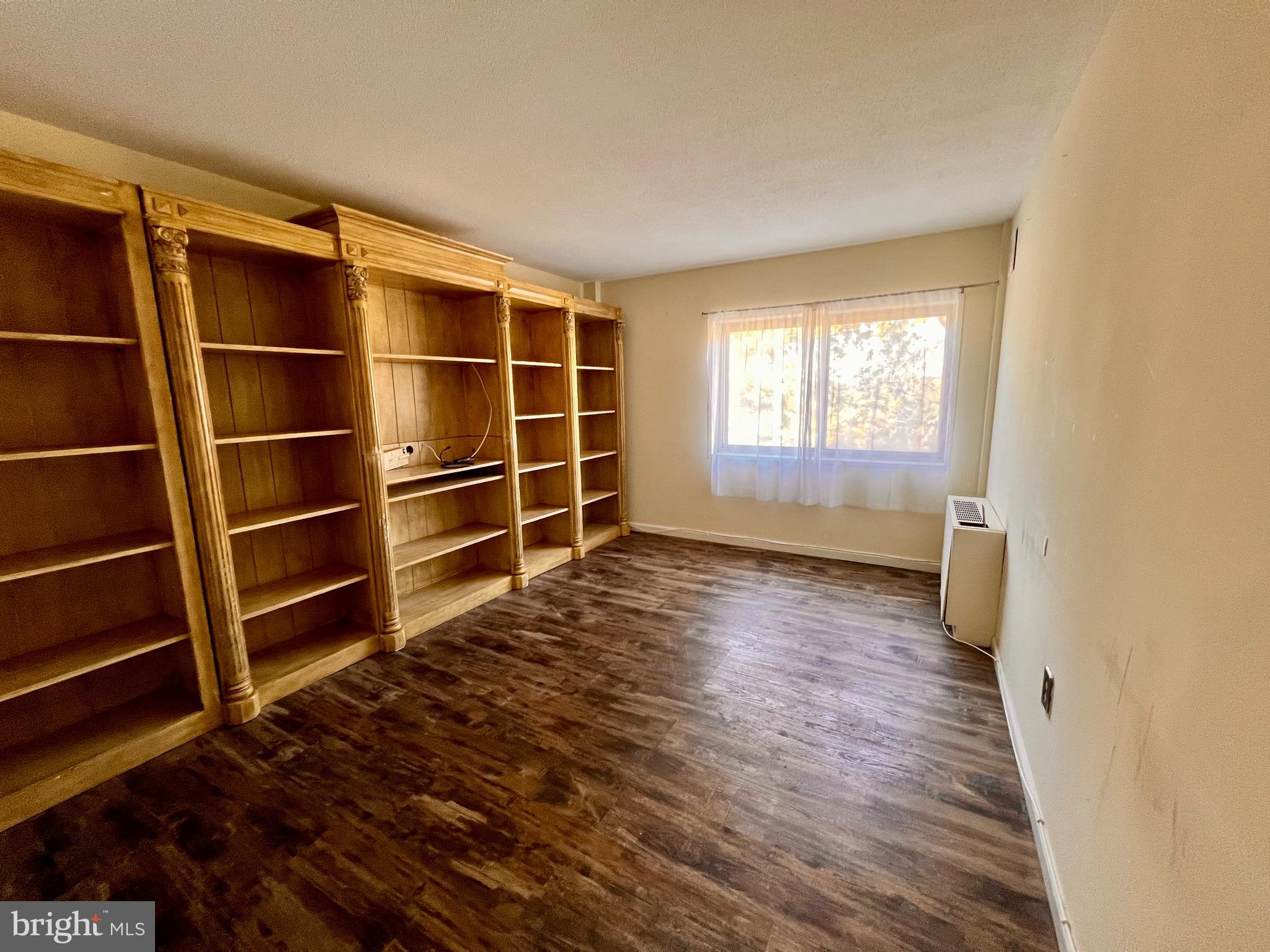 100 West Avenue, Unit 418S Jenkintown, PA 19046 - Photo 14 of 18 a view of empty room with wooden floor and windows
