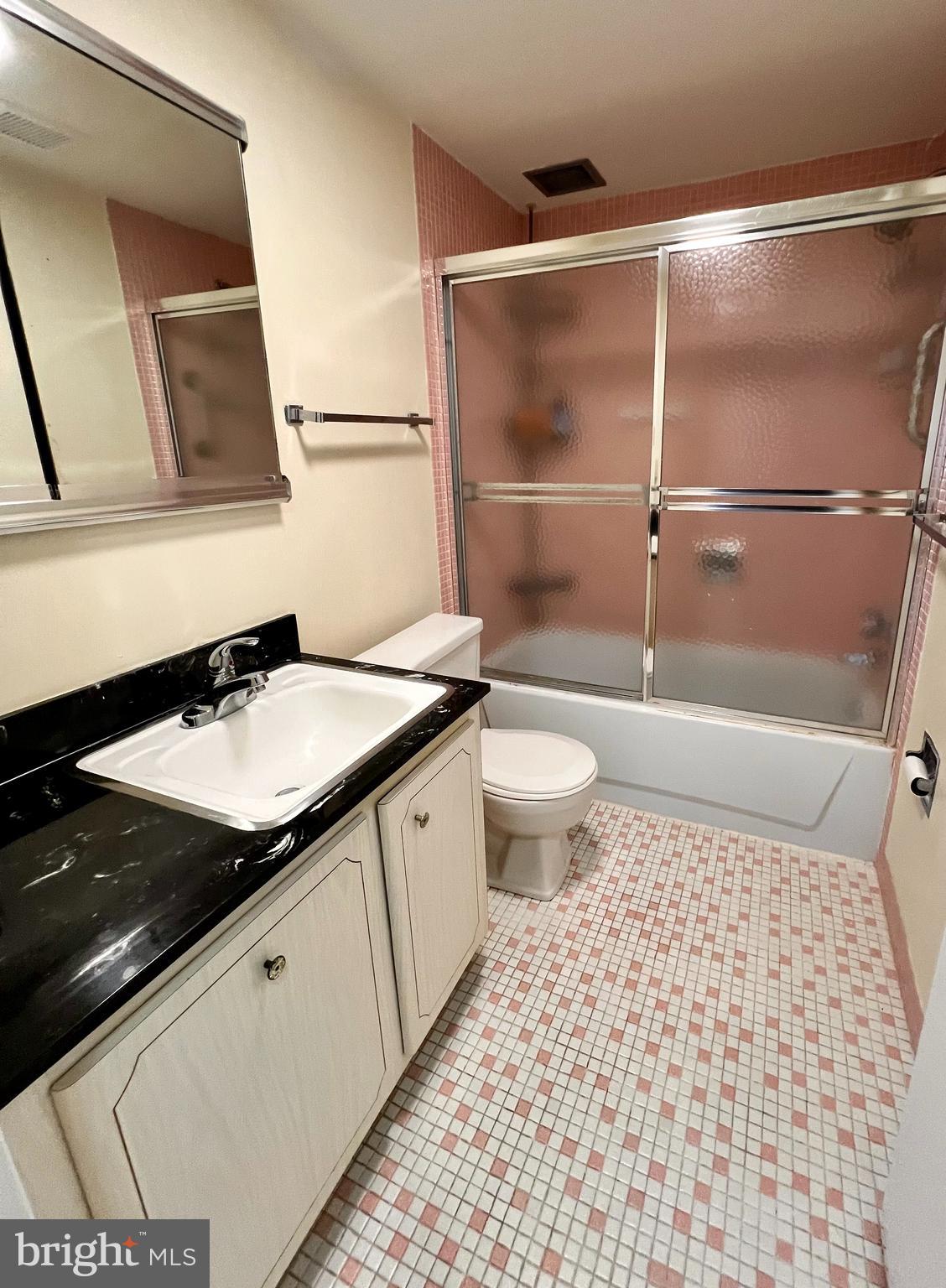 100 West Avenue, Unit 418S Jenkintown, PA 19046 - Photo 15 of 18 a bathroom with a sink a toilet a mirror and shower