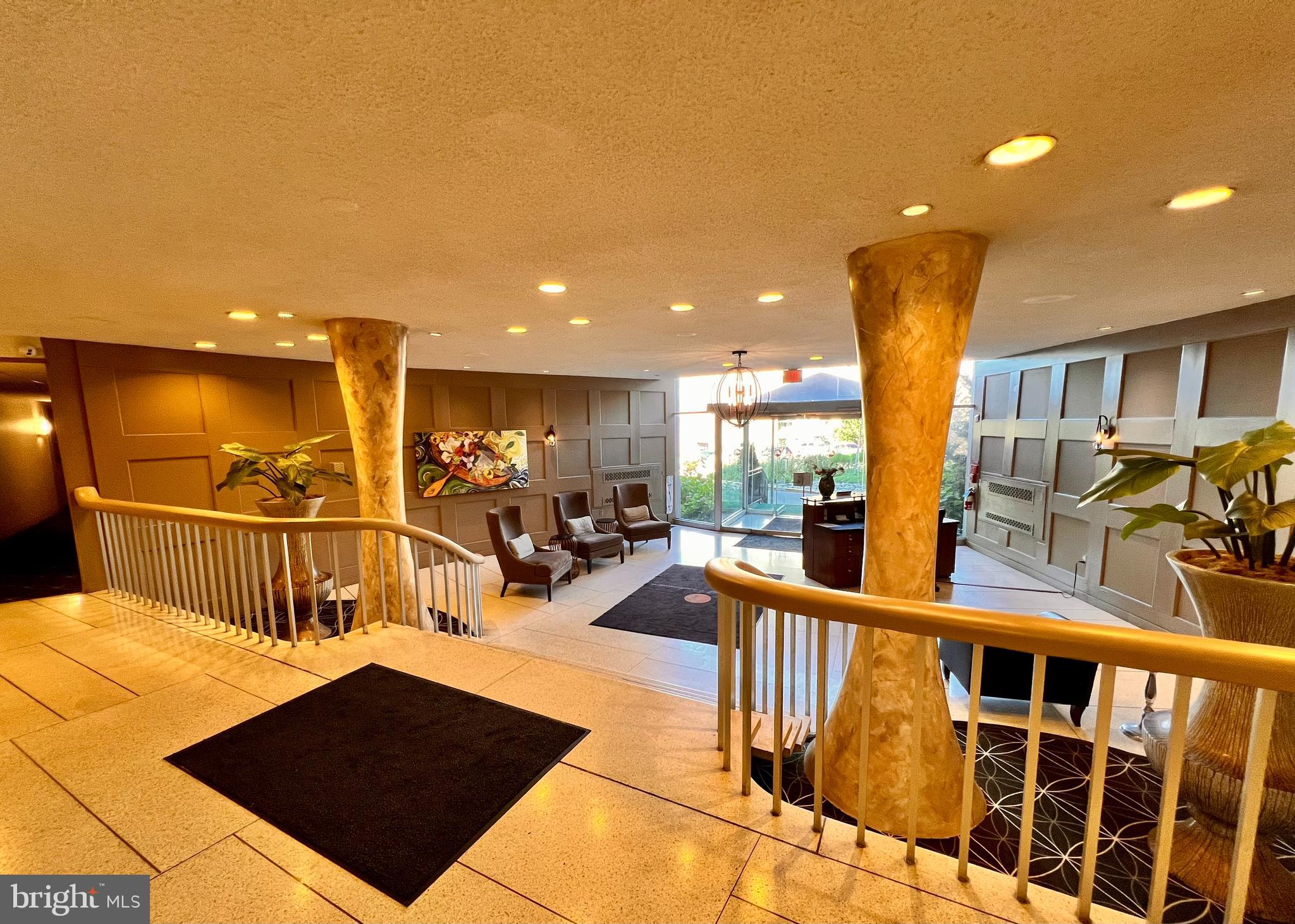 100 West Avenue, Unit 418S Jenkintown, PA 19046 - Photo 17 of 18 a view of a living room with a table and chairs