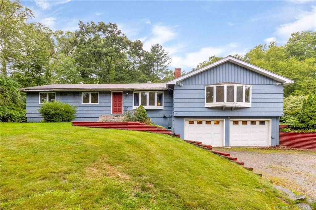 90 Millstream Road Hebron, CT 06231 - Photo 1 of 1 a front view of a house with a yard