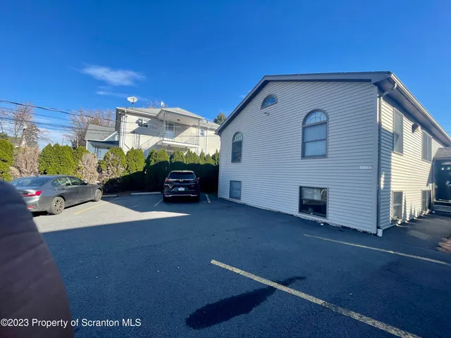 a car parked in front of a house