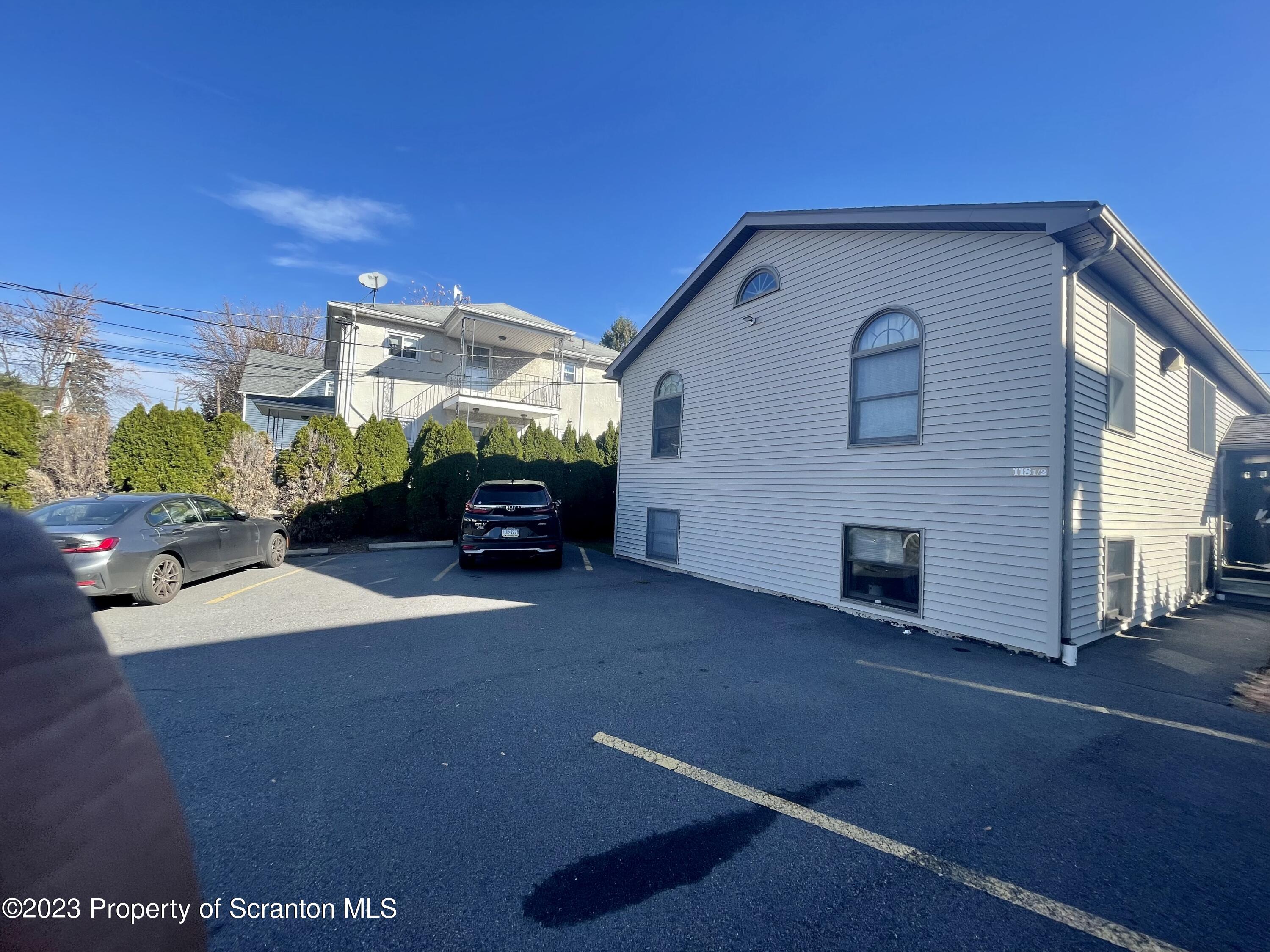 118 1/2 Frank Street, Unit B Dunmore, PA 18512 - Photo 1 of 15 a car parked in front of a house