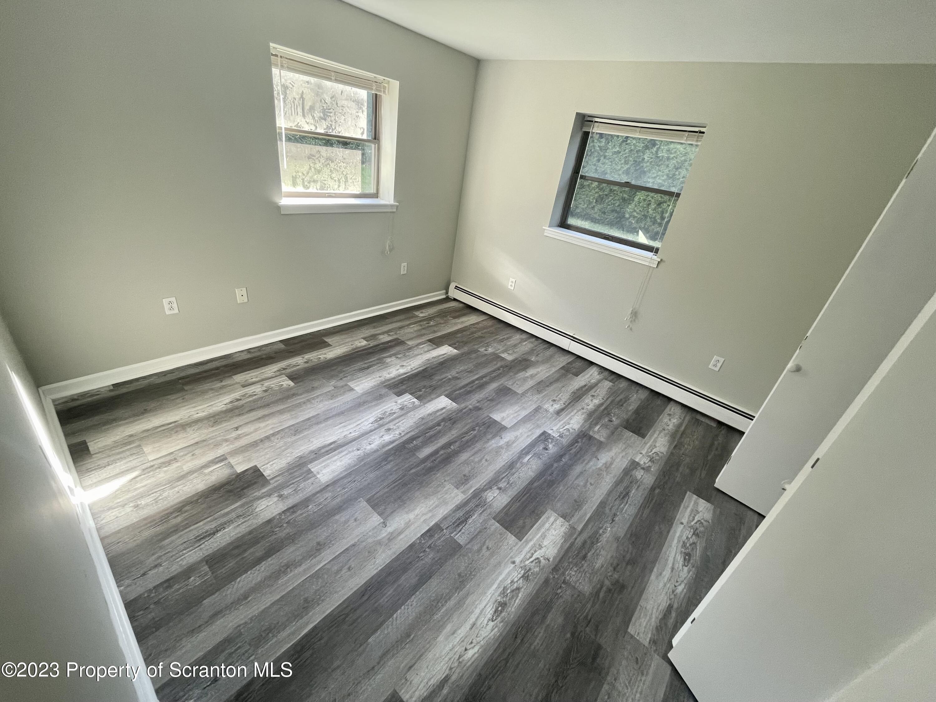 118 1/2 Frank Street, Unit B Dunmore, PA 18512 - Photo 10 of 15 a view of a room with wooden floor and window