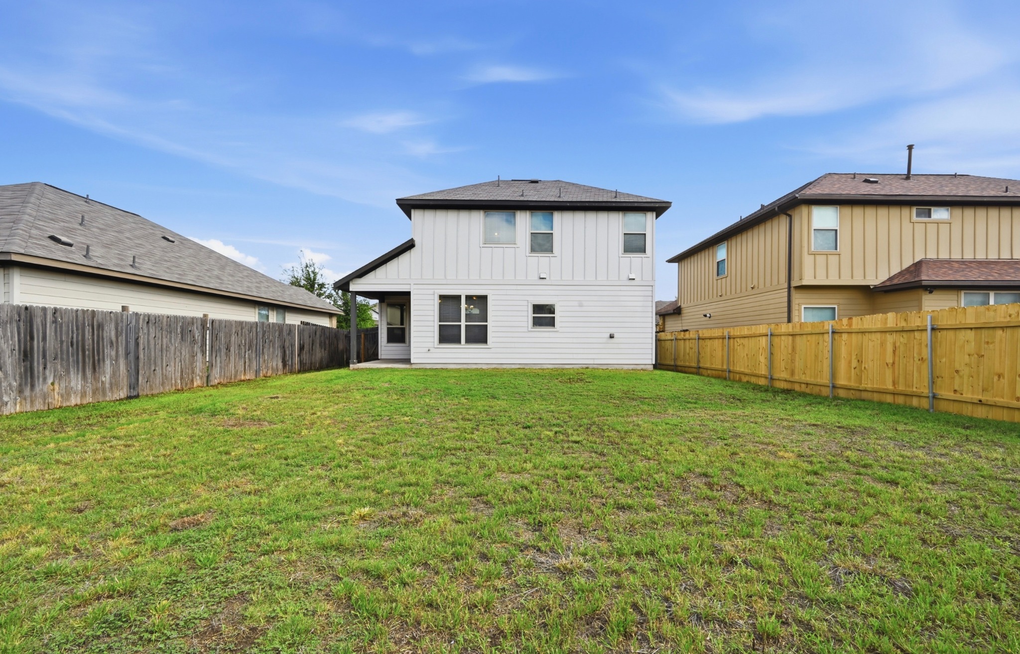 209 Noddy Road Buda, TX 78610 - Photo 26 of 30 Expansive green lawn providing ample outdoor space