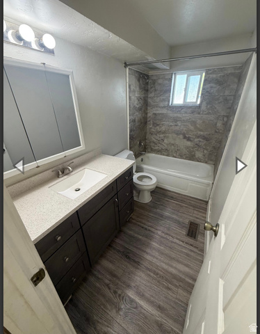 102 East Richelman Lane Wellington, UT 84542 - Photo 36 of 39 Bathroom with shower / bathtub combination, vanity, and dark wood finished floors
