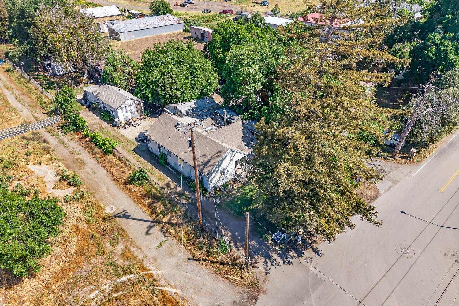 383 Taylor Road Lodi, CA 95242 - Photo 19 of 22 an aerial view of a house with a yard and trees