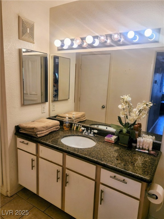 2300 East Silverado Ranch Boulevard, Unit 2158 Las Vegas, NV 89123 - Photo 11 of 19 Bathroom with vanity, tile patterned flooring, and