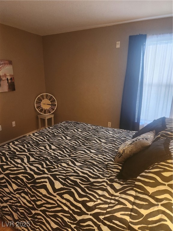 2300 East Silverado Ranch Boulevard, Unit 2158 Las Vegas, NV 89123 - Photo 14 of 19 Bedroom with carpet floors