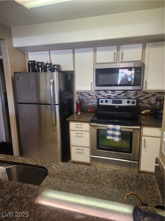 2300 East Silverado Ranch Boulevard, Unit 2158 Las Vegas, NV 89123 - Photo 6 of 19 Kitchen featuring range, refrigerator, backsplash,