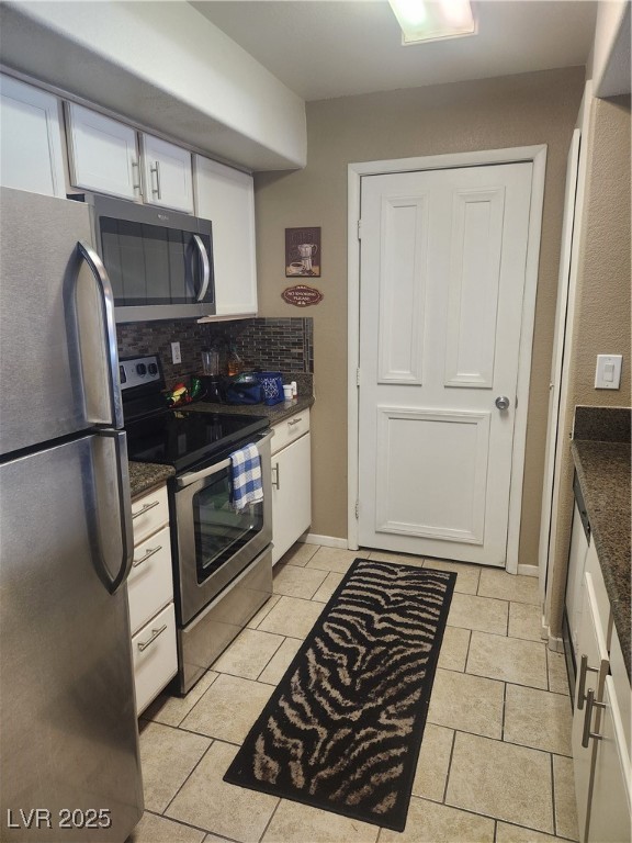 2300 East Silverado Ranch Boulevard, Unit 2158 Las Vegas, NV 89123 - Photo 7 of 19 Kitchen featuring refrigerator, stove, decorative