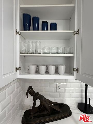 a close view of a stove and microwave with cabinet