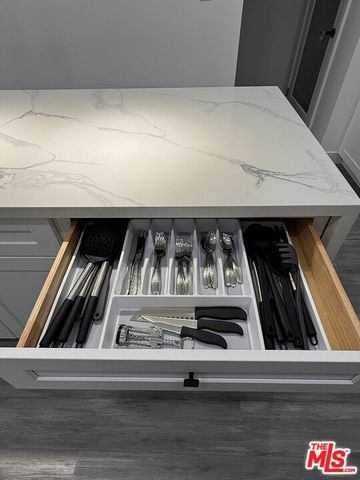 a view of hallway with stairs and wooden floor