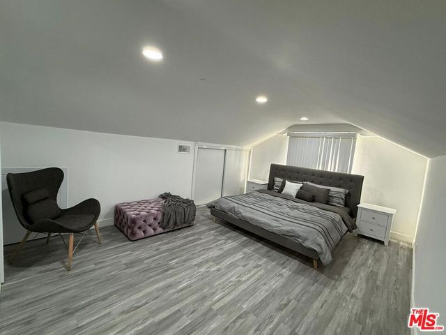 a bathroom with a shower and a sink