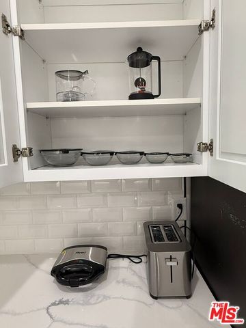 a close view of sink and cabinets