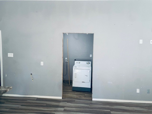 284 County Road 3405 Cleveland, TX 77327 - Photo 14 of 22 a view of a utility room with closet and wooden floor