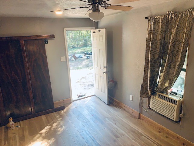 284 County Road 3405 Cleveland, TX 77327 - Photo 18 of 22 a view of an empty room with a window
