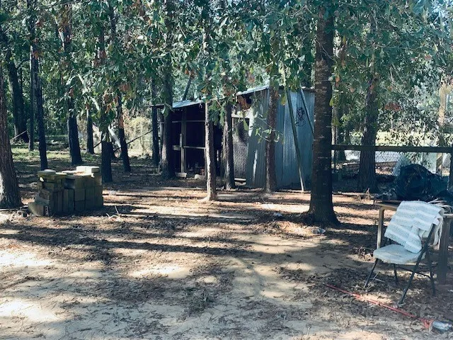a view of a yard with swimming pool