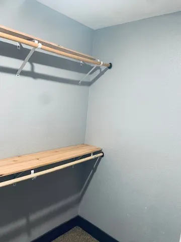 a kitchen with kitchen island sink refrigerator and cabinets