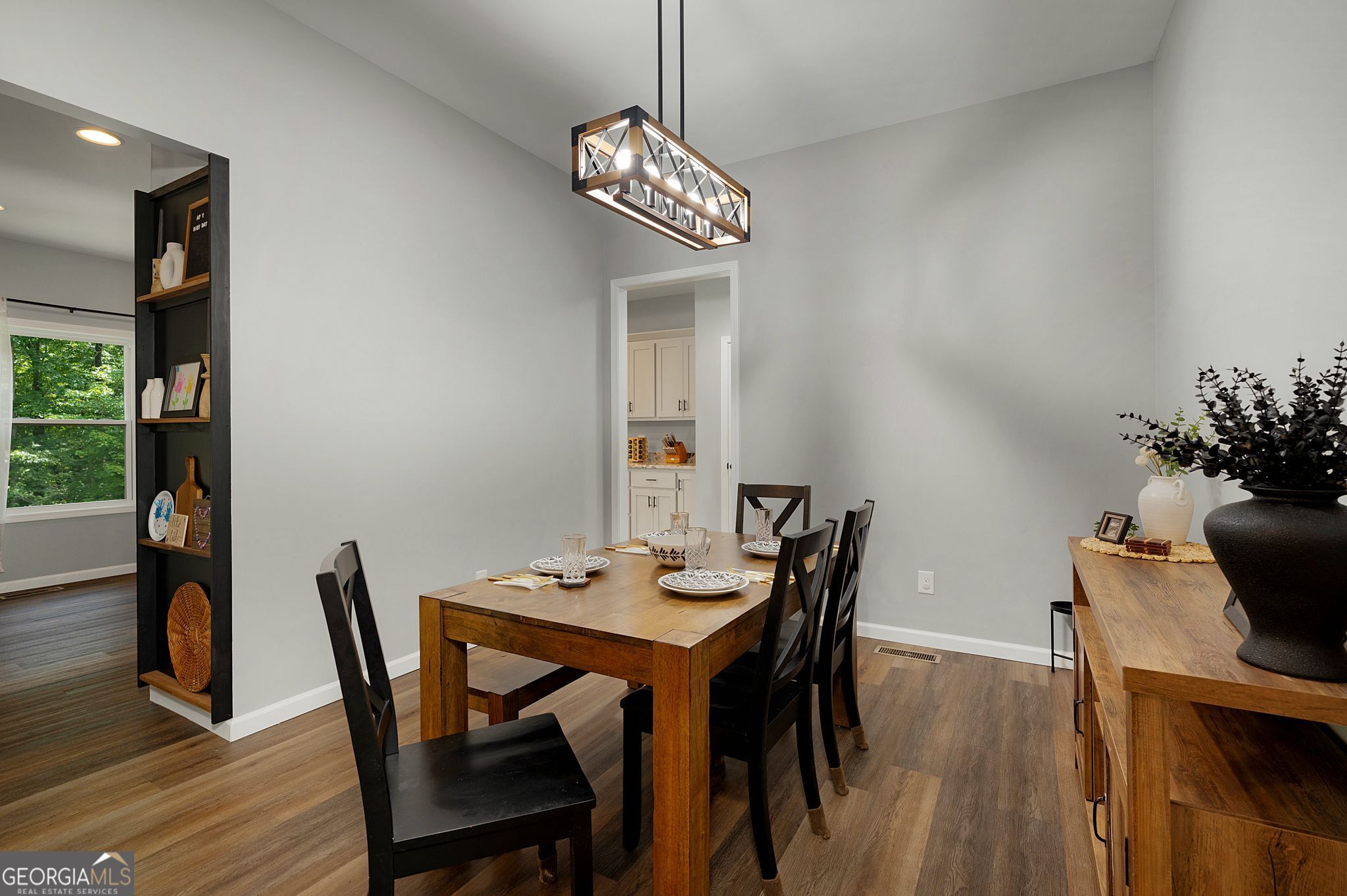 146 Hackney Trail Ellijay, GA 30536 - Photo 5 of 24 a dining room with furniture wooden floor and a chandelier