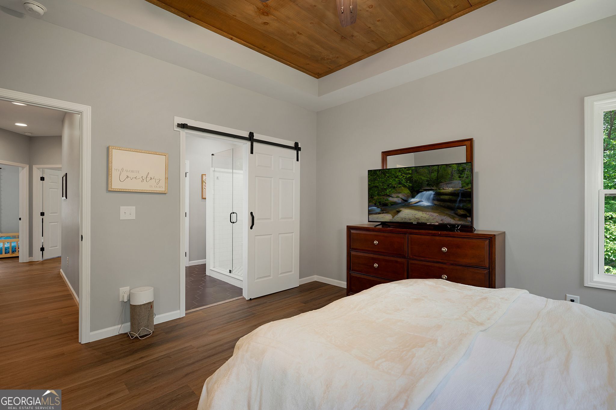 146 Hackney Trail Ellijay, GA 30536 - Photo 6 of 24 a bedroom with a bed and a flat screen tv