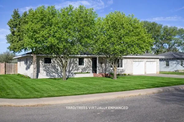 a living room with furniture a flat screen tv and a large window
