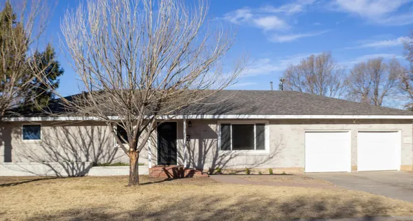 a kitchen with a refrigerator and a sink