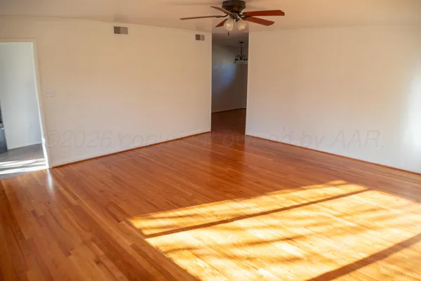 a kitchen with stainless steel appliances kitchen island granite countertop a refrigerator and a stove top oven