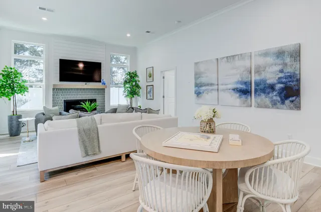 a dining room with furniture a livingroom and chandelier