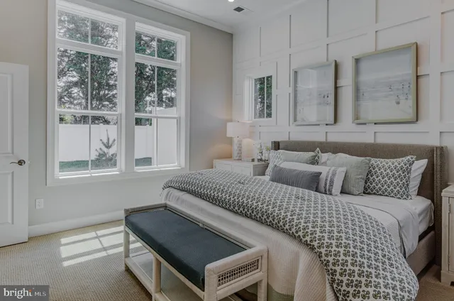 a bedroom with furniture and windows